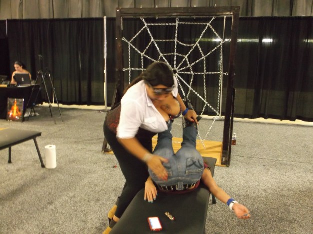 Spanking a female spectator at Exxxotica Expo in Edison NJ - October 5th, 2013